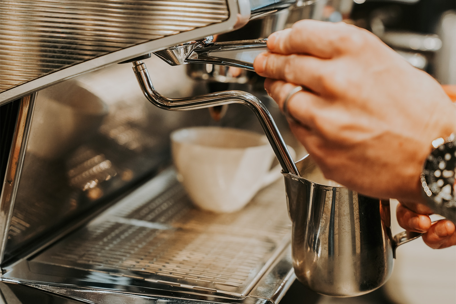 Barista served take away hot coffee cup to customer